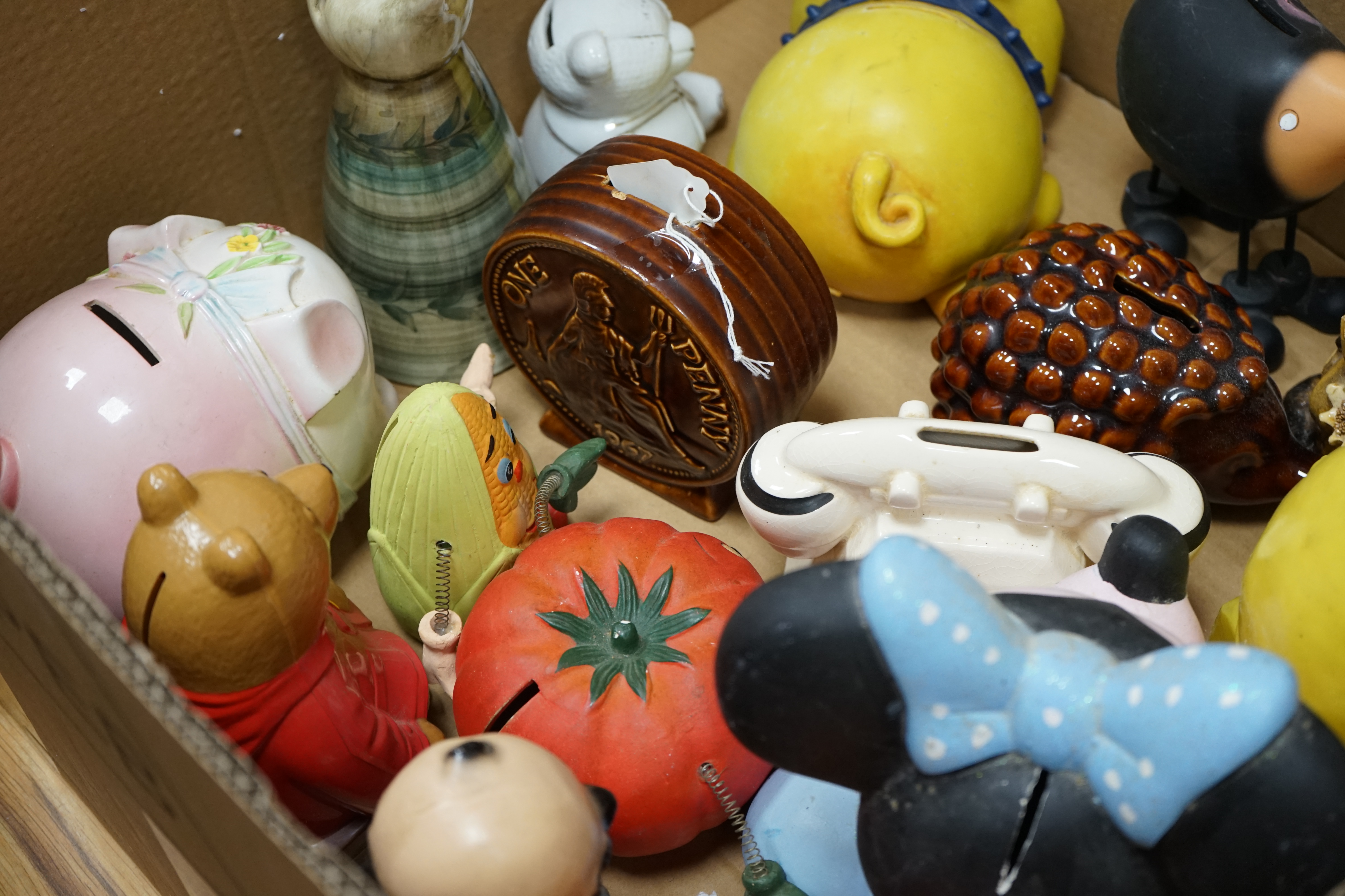 Three boxes of mixed novelty pottery, plastic and metal and wooden money boxes, largest 26cm high. Condition - variable